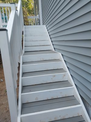 New deck to match the front. - this little deck was built to replace one that was on the verge of coming down. a landing in the stairs was added, and the materials were chosen to match the house.