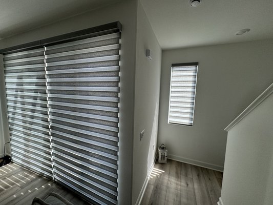 Motorized Zebra Shades - In this project, we installed new motorized zebra shades, bringing a stylish and modern upgrade to the space. The unique design of zebra shades allows for versatile light control, effortlessly alternating between sheer and solid panels. The motorized feature adds a layer of convenience, enabling precise and easy adjustment of the shades with just a touch of a button. This installation not only enhances the room's aesthetics but also offers a practical and elegant solution for managing light and privacy.