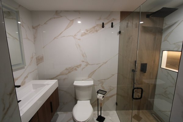 From Closet to Luxury Bathroom - Swipe to see this incredible transformation! What was once a walk-in closet is now a stunning, modern bathroom featuring:
- Large format marble-look tiles for a sleek, elegant design Wood accents to add warmth and sophistication
- Glass shower enclosure with matte black fixtures for a bold touch
- Custom LED-lit shower niche for style and functionality
- Smart mirror with LED lighting for a high-end finish
Transforming spaces is what we do best! Thinking about upgrading your home? Let's make it happen. Contact us today for a free consultation! From Closet to Luxury Bathroom - Swipe to see this incredible transformation! What was once a walk-in closet is now a stunning, modern bathroom featuring:
- Large format marble-look tiles for a sleek, elegant design Wood accents to add warmth and sophistication
- Glass shower enclosure with matte black fixtures for a bold touch
- Custom LED-lit shower niche for style and functionality
- Smart mirror with LED lighting for a high-end finish
Transforming spaces is what we do best! Thinking about upgrading your home? Let's make it happen. Contact us today for a free consultation!