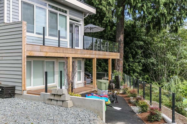 RCGlass - Step into a world of contemporary elegance with this captivating outdoor space featuring sleek glass railings. The transparent allure of the glass rail effortlessly harmonizes with the surroundings, offering unobstructed views and a sense of expansive openness.
The deck, adorned with modernity, becomes a stage for both design and nature to shine. The glass railing serves as a sophisticated frame, allowing the scenic beauty to take center stage while providing a subtle touch of refinement to the overall aesthetic.
As the sunlight dances on the glass, it creates a play of reflections and shadows, adding an extra layer of visual interest to the outdoor ambiance. The seamless integration of glass railings gives the space a timeless quality, making it an ideal setting for moments of tranquility or lively gatherings.
Whether you're enjoying a morning coffee with a panoramic sunrise or hosting an evening soirée under the stars, the glass railings become an integral part of the experience, enhancing both the safety and allure of this stylish outdoor retreat. Elevate your outdoor living with the contemporary allure of glass, where sophistication meets the beauty of the natural world. RCGlass - Step into a world of contemporary elegance with this captivating outdoor space featuring sleek glass railings. The transparent allure of the glass rail effortlessly harmonizes with the surroundings, offering unobstructed views and a sense of expansive openness.
The deck, adorned with modernity, becomes a stage for both design and nature to shine. The glass railing serves as a sophisticated frame, allowing the scenic beauty to take center stage while providing a subtle touch of refinement to the overall aesthetic.
As the sunlight dances on the glass, it creates a play of reflections and shadows, adding an extra layer of visual interest to the outdoor ambiance. The seamless integration of glass railings gives the space a timeless quality, making it an ideal setting for moments of tranquility or lively gatherings.
Whether you're enjoying a morning coffee with a panoramic sunrise or hosting an evening soirée under the stars, the glass railings become an integral part of the experience, enhancing both the safety and allure of this stylish outdoor retreat. Elevate your outdoor living with the contemporary allure of glass, where sophistication meets the beauty of the natural world.