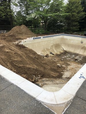 Phoenix Retaining Wall and pool infill - We were asked to infill a pool, install a battered block retainer wall, then a concrete patio with some steps