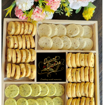 Fusion shortbreads - Herb Spiced Shortbread: Experience a delightful twist on classic shortbread with our Herb Spiced variety. Infused with a blend of aromatic herbs, each bite offers a unique, savory-sweet flavor that’s perfect for a sophisticated snack or pairing with cheese and wine.
Rose Almond Shortbread: Delight in the delicate flavors of rose and almond in this luxurious shortbread. The subtle floral notes of rose combined with the nutty richness of almond create an exquisite treat that’s both fragrant and flavorful, perfect for any special occasion.
Tooty Fruity Shortbread: Enjoy a burst of fruity goodness in our Tooty Fruity Shortbread. Packed with colorful, dried fruits, each piece offers a chewy and sweet surprise, making it a fun and delicious treat for kids and adults alike.
Cumin Shortbread: Discover the unique and aromatic flavor of cumin in our Cumin Shortbread. This fusion of savory spice and buttery shortbread creates a distinctive and delightful taste experience that’s perfect for adventurous palates and gourmet gatherings. Fusion shortbreads - Herb Spiced Shortbread: Experience a delightful twist on classic shortbread with our Herb Spiced variety. Infused with a blend of aromatic herbs, each bite offers a unique, savory-sweet flavor that’s perfect for a sophisticated snack or pairing with cheese and wine.
Rose Almond Shortbread: Delight in the delicate flavors of rose and almond in this luxurious shortbread. The subtle floral notes of rose combined with the nutty richness of almond create an exquisite treat that’s both fragrant and flavorful, perfect for any special occasion.
Tooty Fruity Shortbread: Enjoy a burst of fruity goodness in our Tooty Fruity Shortbread. Packed with colorful, dried fruits, each piece offers a chewy and sweet surprise, making it a fun and delicious treat for kids and adults alike.
Cumin Shortbread: Discover the unique and aromatic flavor of cumin in our Cumin Shortbread. This fusion of savory spice and buttery shortbread creates a distinctive and delightful taste experience that’s perfect for adventurous palates and gourmet gatherings.