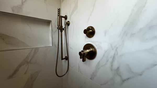 Luxury Bathroom Trim - Our plumber completed this bathroom project, carefully installing all the high-end fixtures.