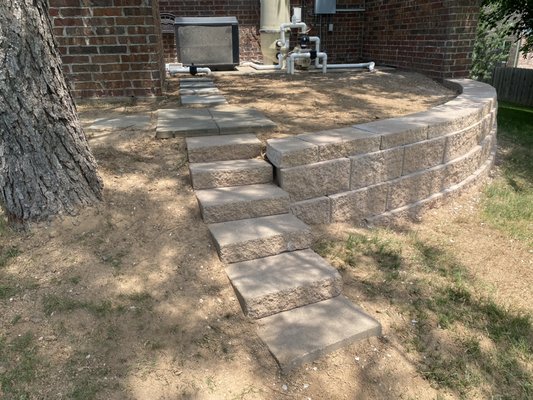 Retaining wall with curved stairway install - We built a retaining wall with a curved staircase leading from the upper to lower portion of the wall. The customer was having erosionnissue behind their pool
House that needed addressed and we decided the retaining wall was their best option. It turned out amazing!
