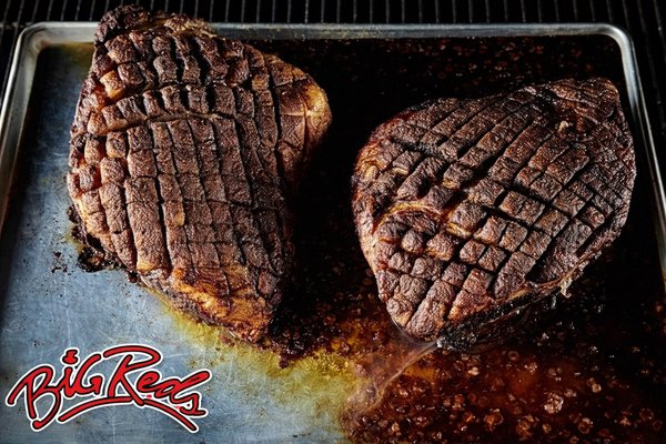 Food We Serve - At Big Red’s Pig Party, everything we serve is built around real barbecue. No shortcuts, no reheats, no mass-produced trays. Our food is cooked low and slow, finished on site when possible, and served fresh so guests can see, smell, and experience the process as much as they enjoy the meal.

We specialize in whole hog roasts, smoked meats, and classic barbecue sides that pair perfectly with a laid-back backyard party, upscale corporate event, wedding celebration, or large community gathering. Whether we’re roasting a pig in front of your guests or delivering perfectly prepared trays ready to serve, the focus is always the same: bold flavor, generous portions, and food people remember.

Our Smoked Meats & Proteins
	•	Whole Hog Pig Roast – Our signature offering. A full pig slow-roasted until the skin crisps and the meat pulls clean and juicy. Carved and served fresh in front of guests for a true show-stopping experience.
	•	Pulled Pork – Smoked for hours until tender, hand-pulled, and seasoned to highlight the smoke and natural flavor of the pork.
	•	Pulled Chicken – Juicy, lightly smoked chicken that provides a great alternative to pork while still delivering classic BBQ flavor.
	•	Smoked Sausage – Hearty, smoky sausage sliced and served hot, perfect as a main protein or an add-on.
	•	Smoked Wings – Slow-smoked wings finished to be tender with a crisp bite.
	•	Smoked Turkey Breast – Lean, flavorful, and surprisingly juicy, great for mixed crowds.
	•	Smoked Ham – Rich, smoky, and carved fresh for events that want something a little different.
	•	Ribs – Smoked low and slow until tender with a deep, savory bark.

All meats are served with fresh buns and our full lineup of BBQ sauces, ranging from classic and sweet to bold and tangy, so guests can build their plate exactly how they want.

Classic BBQ Sides
Our sides are made to complement the smoke and richness of the meats, offering balance, comfort, and crowd-pleasing flavor.

Standard Sides
	•	Baked Beans
	•	Cole Slaw
	•	Green Beans
	•	Caesar Salad
	•	Corn Bread
	•	Pasta Salad

Premium Sides
	•	Mac and Cheese – Creamy, rich, and always a crowd favorite
	•	Potato Salad – A classic BBQ staple done right

What You Can Expect
Whether you’re browsing this portfolio after seeing us at a corporate event, backyard party, or wedding, what you’re seeing is exactly what we serve. Real food, cooked in real smokers, served hot and fresh with professional presentation.

From plated meals to buffet setups and full on-site pig roasts, our menu is designed to be flexible, generous, and memorable. It’s the kind of food people come back for and talk about long after the party’s over.

If you’re looking for authentic barbecue that feels like an experience, not just catering, you’re in the right place.