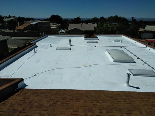 Complete TPO installation - This project required a complete reroof of the flat roof as well as the pitched roof. The Pitched roof is Owens Corning shingles, and the color is Desert Tan. The flat reroof is a complete installation of white TPO 60 mil thick. The advantage to white is an increase in the albedo of the roof aiding in the reduction of the heat island effect. Complete TPO installation - This project required a complete reroof of the flat roof as well as the pitched roof. The Pitched roof is Owens Corning shingles, and the color is Desert Tan. The flat reroof is a complete installation of white TPO 60 mil thick. The advantage to white is an increase in the albedo of the roof aiding in the reduction of the heat island effect.