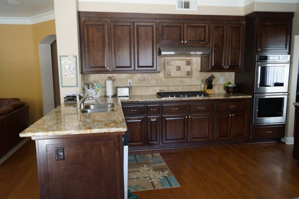 Kitchen Remodel - This remodel was done on an old, tired kitchen. Installed custom cabinets, granite countertops and backsplash. Under cabinet lighting and new appliances. Kitchen Remodel - This remodel was done on an old, tired kitchen. Installed custom cabinets, granite countertops and backsplash. Under cabinet lighting and new appliances.