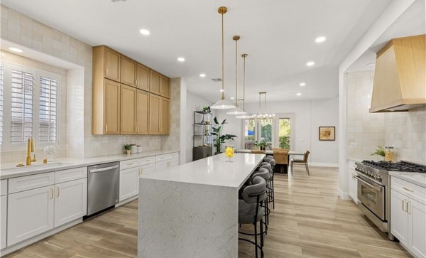 Kitchen Remodel - This kitchen remodel transforms the space into a modern, functional, and sophisticated gathering area. The design features custom cabinetry, durable countertops, updated flooring, modern lighting, and a thoughtfully planned layout that improves storage and workflow. Carefully selected finishes and fixtures create a cohesive, timeless look while enhancing the comfort and value of the home.