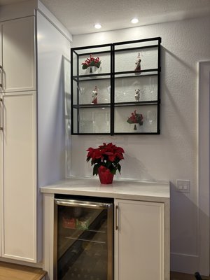 Show Case Cabinet; Floating Glass. - Show case cabinet for a customer. 1/4” tempered glass precut, frame welded and ground, powder coated, then silicone to hold glass into place. Show Case Cabinet; Floating Glass. - Show case cabinet for a customer. 1/4” tempered glass precut, frame welded and ground, powder coated, then silicone to hold glass into place.