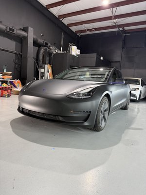 Tesla Model 3 Matte Black Wrap, KPMF Matte Iced Amethyst Titanium accents - Full color change on this Tesla Model 3 using 3M Matte Black, finished with KPMF Matte Iced Amethyst Titanium accents for a subtle purple contrast.
A custom combination that gives the Model 3 a completely different look while keeping the finish clean and understated.
Installed by Wrap Oasis in the DFW area. Tesla Model 3 Matte Black Wrap, KPMF Matte Iced Amethyst Titanium accents - Full color change on this Tesla Model 3 using 3M Matte Black, finished with KPMF Matte Iced Amethyst Titanium accents for a subtle purple contrast.
A custom combination that gives the Model 3 a completely different look while keeping the finish clean and understated.
Installed by Wrap Oasis in the DFW area.