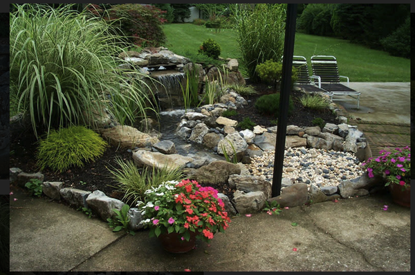 Waterfalls - At Paradise Ponds, we specialize in creating stunning waterfalls that bring movement, sound, and beauty to your outdoor space—without the need for a pond. Our waterfall designs are perfect for homeowners looking to add a natural, tranquil ambiance to their garden, patio, or backyard while maintaining a clean, low-maintenance landscape.