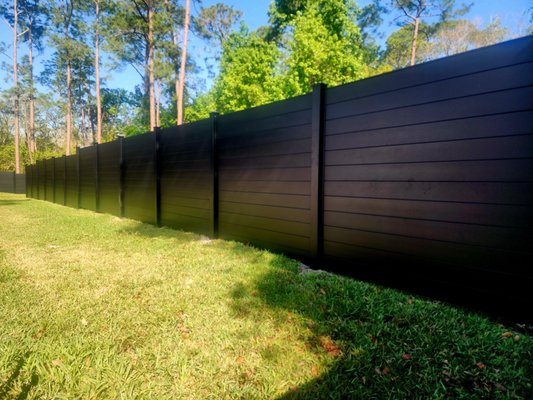 The Black Beauty called SleekFence - This is the new standard of Privacy fencing in Florida! It's 6ft tall full privacy, tongue and groove Aluminum fencing from SleekFence. This product comes 4-8ft tall with fully private and semi private options.