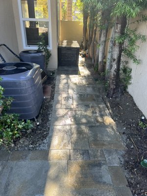 Laguna Niguel back yard remodel - This job had to be done because the existing drainage system had failed. All the pavers were installed on concrete so there was no saving them. We did the job with Belgard dimensions 18 in Victorian color. We also installed a 20’ custom channel drain drain with paver inserts that hide the drain. You can see it running down the middle of patio. They were having problems with water coming up through there driveway because of the faulty drainage so we found the problem and fixed it. No more water problems and happy customer. Laguna Niguel back yard remodel - This job had to be done because the existing drainage system had failed. All the pavers were installed on concrete so there was no saving them. We did the job with Belgard dimensions 18 in Victorian color. We also installed a 20’ custom channel drain drain with paver inserts that hide the drain. You can see it running down the middle of patio. They were having problems with water coming up through there driveway because of the faulty drainage so we found the problem and fixed it. No more water problems and happy customer.