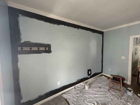 Living room paint job. Mocha brown with a black matte accent wall 🔥 - This paint job was pretty straight forward. Client wanted a new look in her living room and dining room which are both the same color. After we were finished, it looks like a new home!