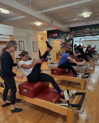 🏋️♂️ Semi-Private Equipment Classes - Our Semi-Private Equipment Classes are the heart of the Pilates Glow studio experience. Designed for intimate groups of 3-6 people, these classes provide individualized attention within a supportive community. You’ll work with classical Pilates apparatus—including reformers, towers, and chairs—to strengthen and stretch your body in ways that are safe, effective, and adapted to your abilities. Whether you’re recovering from injury, managing pain, or striving for peak performance, our instructors tailor sessions to meet your needs. Every participant benefits from clear, encouraging cues and a program that challenges without overwhelming. Our commitment to small groups ensures a nurturing environment where you can thrive, progress quickly, and enjoy the camaraderie of others on their own Pilates path. 🏋️♂️ Semi-Private Equipment Classes - Our Semi-Private Equipment Classes are the heart of the Pilates Glow studio experience. Designed for intimate groups of 3-6 people, these classes provide individualized attention within a supportive community. You’ll work with classical Pilates apparatus—including reformers, towers, and chairs—to strengthen and stretch your body in ways that are safe, effective, and adapted to your abilities. Whether you’re recovering from injury, managing pain, or striving for peak performance, our instructors tailor sessions to meet your needs. Every participant benefits from clear, encouraging cues and a program that challenges without overwhelming. Our commitment to small groups ensures a nurturing environment where you can thrive, progress quickly, and enjoy the camaraderie of others on their own Pilates path.