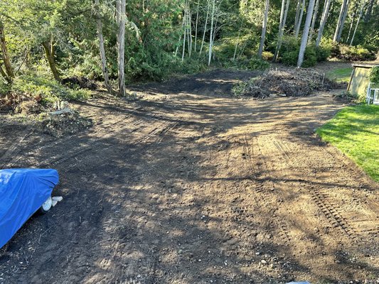 Lot clearing and grading - A client needed their lot cleared, removed a few trees and stumps. Piled up all of the debris since they didn't want it hauled off. Cut up the trees and stacked it nicely for them to burn the following season. Sloped their embankment and graded out their property. Lot clearing and grading - A client needed their lot cleared, removed a few trees and stumps. Piled up all of the debris since they didn't want it hauled off. Cut up the trees and stacked it nicely for them to burn the following season. Sloped their embankment and graded out their property.