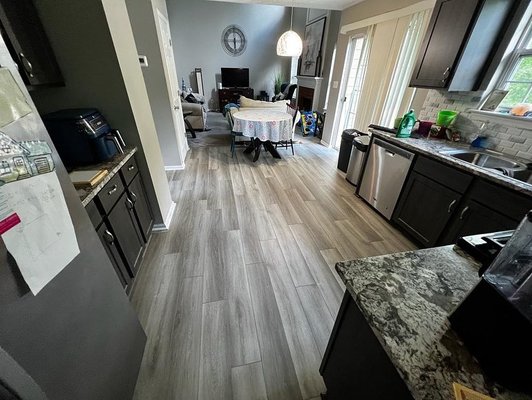 Luxury Vinyl Plank flooring installation - Luxury Vinyl Plank flooring installation on kitchen, dining room and living room.