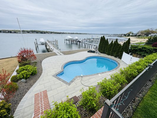 Pool Renovation - Point Pleasant - This renovation focused on upgrading both performance and aesthetics for a more modern, efficient pool. We replaced the existing fiberglass step with a new steel corner radius step, finished seamlessly with a liner-over design for a clean, integrated look. The system was upgraded with all new energy-efficient equipment, and an LED color-changing light was added to enhance the pool’s ambiance. The pool was completed with a premium Maui liner from Dover Vinyl. To tie everything together, the customer also invested in a full patio renovation with new pavers, creating a refreshed and cohesive outdoor space. Pool Renovation - Point Pleasant - This renovation focused on upgrading both performance and aesthetics for a more modern, efficient pool. We replaced the existing fiberglass step with a new steel corner radius step, finished seamlessly with a liner-over design for a clean, integrated look. The system was upgraded with all new energy-efficient equipment, and an LED color-changing light was added to enhance the pool’s ambiance. The pool was completed with a premium Maui liner from Dover Vinyl. To tie everything together, the customer also invested in a full patio renovation with new pavers, creating a refreshed and cohesive outdoor space.