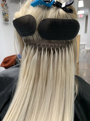 Hair Extension Services - Fusion also knows as keratin tipped extensions are a very popular method of extensions. The application lasts up to 4 months, after 4 months they are removed a new set can be installed. I usually recommend a client takes about a week break to shampoo and deep conditioner their hair before installing a new set. A typical application can take 2-4 hours depending on the thickness of the clients hair. As far as cost an average installation with hair included is around $1100-1300.