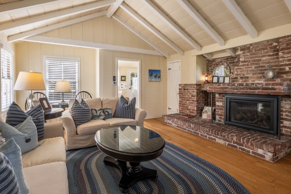 Home Port Cottage and Sky Way Cottage - Home Port is a one story cottage that features a king bedroom, a living room with a sofa/sleeper, a toasty gas fireplace, a kitchen, and a patio right off the rose garden. Internet access available.
Maximum Occupancy: 4 regardless of age

Sky Way is an upstairs studio that is just perfect for two. It has a queen bedroom, a full bath, a living room and a thoughtful kitchenette. Internet access available.
Maximum Occupancy: 2 regardless of age