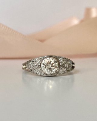 Antique Diamond Engagement Ring - A lovely platinum and 14k white gold diamond engagement ring with millegrain detail throughout. The center old european cut diamond weighs approx. 0.50cts. Antique Diamond Engagement Ring - A lovely platinum and 14k white gold diamond engagement ring with millegrain detail throughout. The center old european cut diamond weighs approx. 0.50cts.