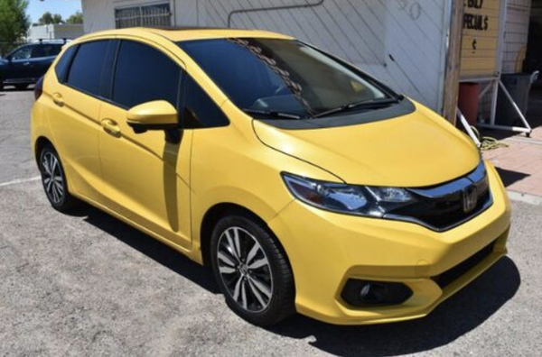 2018 Honda Fit Special - 2018 Honda Fit EX CVT
Be prepared to take on your next adventure with our 2018 Honda Fit EX Hatchback shown in Helios Yellow Pearl! Our spirited Fit exudes confidence and is powered by a 1.5 Liter 4 Cylinder generating 130hp paired with a responsible CVT for fun acceleration. This Front Wheel Drive hatchback achieves near 36mpg on the open road. Our athletic Fit EX immediately greets you with 16-inch machine-finished alloy wheels, fog lights, power sunroof, and body-colored rear roofline spoiler. Once inside the EX cabin, you will be impressed with the 60/40 split Magic Seat that folds flat into the floor for maximum cargo space. Connect with your friends, family, and coworkers safely via Bluetooth. Turn up the tunes on your amazing 6 speaker audio system with 7-inch color LCD screen by using the illuminated steering wheel-mounted controls. Apple Car Play and Android Auto accommodate your phone choice. Load up the Fit with your crew or lower the rear seat and take a quieter ride when loading up the cargo area. Safety is a priority at Honda with advanced features such as a multi-angle rearview camera, hill start assist, Honda Lane Watch, and 6 airbags, so you have that peace of mind as you sit back and appreciate the ride in this Fit! Save this Page and Call for Availability. We Know You Will Enjoy Your Test Drive Towards Ownership! 2018 Honda Fit Special - 2018 Honda Fit EX CVT
Be prepared to take on your next adventure with our 2018 Honda Fit EX Hatchback shown in Helios Yellow Pearl! Our spirited Fit exudes confidence and is powered by a 1.5 Liter 4 Cylinder generating 130hp paired with a responsible CVT for fun acceleration. This Front Wheel Drive hatchback achieves near 36mpg on the open road. Our athletic Fit EX immediately greets you with 16-inch machine-finished alloy wheels, fog lights, power sunroof, and body-colored rear roofline spoiler. Once inside the EX cabin, you will be impressed with the 60/40 split Magic Seat that folds flat into the floor for maximum cargo space. Connect with your friends, family, and coworkers safely via Bluetooth. Turn up the tunes on your amazing 6 speaker audio system with 7-inch color LCD screen by using the illuminated steering wheel-mounted controls. Apple Car Play and Android Auto accommodate your phone choice. Load up the Fit with your crew or lower the rear seat and take a quieter ride when loading up the cargo area. Safety is a priority at Honda with advanced features such as a multi-angle rearview camera, hill start assist, Honda Lane Watch, and 6 airbags, so you have that peace of mind as you sit back and appreciate the ride in this Fit! Save this Page and Call for Availability. We Know You Will Enjoy Your Test Drive Towards Ownership!