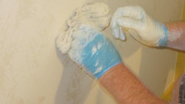 Rag rolling - This is a re-do after the customer had water damage around her fireplace. Repainted the room and applied the rag rolling technique to match the existing finish.