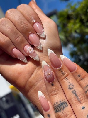 Nails - A closer look at custom nail designs created at Brisa Nail Spa in Miami. This collection features soft pink floral details, bold blue designs, and sculpted white accents—each set with its own personality.

From subtle elegance to statement nail art, we tailor the shape, length, colors, and details to your style. Bring your inspiration or let us help you create your next favorite set.