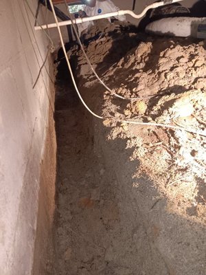 Crawlspace encapsulation with drainage - Crawlspace encapsulation with water removal, drainage install. Completed with insulation, spray foam air seal out, vapor barrier, insulation foam board, sump pump with a dehumidifier