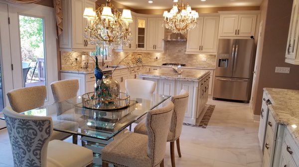 Another dream kitchen finished! - This kitchen had an 20-years old maple cabinets and kitchen had hardwood flooring. Replaced hardwood flooring with nice big porcelain tiles along with beautiful off-white elegant cabinets. We also complemented the work with nice crown molding and expanded the island. We have also replaced the microwave with a nice hood and moved the microwave to the island. Another dream kitchen finished! - This kitchen had an 20-years old maple cabinets and kitchen had hardwood flooring. Replaced hardwood flooring with nice big porcelain tiles along with beautiful off-white elegant cabinets. We also complemented the work with nice crown molding and expanded the island. We have also replaced the microwave with a nice hood and moved the microwave to the island.