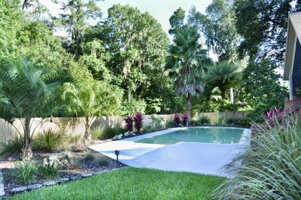 Tropical Landscape - Services performed: Design consultation, 3D rendering, sod installation, mulching and plant installation
A client reached out to us asking for a North Florida tropical landscape design. They had already been through several designers, and been disappointed by the lack of creativity, and lack of foresight as to how well their plants would survive. We were dedicated to creating a long-lasting landscape for this client, with plants well-suited for their yard. By testing samples of our client’s soil at IFAS at the University of Florida, we were able to target what issues were in the soil, and how to amend them and plant accordingly. This ensured the installation of plant material that would survive and stay healthy!
One of the most important things to us is listening to each client and giving them an experience custom-tailored to their desires for their landscape. After discovering what options were viable for this client’s landscape, we were able to approach them with the options and have them select what they wanted and what they liked best. This method of collaboration on which plants and other elements to use is an important part of our design process, and helps us meet every client’s expectations for the beautiful, creative landscape they have envisioned.
This client's yard had recently been cleared of trees, leaving space for a landscape full of texture and color. As a geologist, they desired to incorporate ornate lime rocks throughout the landscape. The use of large rocks is common in tropical landscaping as a striking contrast to the dense foliage. We used decorative grasses to give texture and depth to the landscape, added colorful, drought-resistant plants, and brought in palm trees to emphasize the tropical aesthetic. We removed dying plants that were creating a strain on the landscape, and added tropical materials while keeping as much existing plant material as possible, so the landscape would still fit in with the rest of the neighborhood.
No matter what landscape design we create and install, we always strive to not only make it work with what is possible for the client’s home, but also to customize it to fit their personality, preferences, and style. Contact us today to get started! Tropical Landscape - Services performed: Design consultation, 3D rendering, sod installation, mulching and plant installation
A client reached out to us asking for a North Florida tropical landscape design. They had already been through several designers, and been disappointed by the lack of creativity, and lack of foresight as to how well their plants would survive. We were dedicated to creating a long-lasting landscape for this client, with plants well-suited for their yard. By testing samples of our client’s soil at IFAS at the University of Florida, we were able to target what issues were in the soil, and how to amend them and plant accordingly. This ensured the installation of plant material that would survive and stay healthy!
One of the most important things to us is listening to each client and giving them an experience custom-tailored to their desires for their landscape. After discovering what options were viable for this client’s landscape, we were able to approach them with the options and have them select what they wanted and what they liked best. This method of collaboration on which plants and other elements to use is an important part of our design process, and helps us meet every client’s expectations for the beautiful, creative landscape they have envisioned.
This client's yard had recently been cleared of trees, leaving space for a landscape full of texture and color. As a geologist, they desired to incorporate ornate lime rocks throughout the landscape. The use of large rocks is common in tropical landscaping as a striking contrast to the dense foliage. We used decorative grasses to give texture and depth to the landscape, added colorful, drought-resistant plants, and brought in palm trees to emphasize the tropical aesthetic. We removed dying plants that were creating a strain on the landscape, and added tropical materials while keeping as much existing plant material as possible, so the landscape would still fit in with the rest of the neighborhood.
No matter what landscape design we create and install, we always strive to not only make it work with what is possible for the client’s home, but also to customize it to fit their personality, preferences, and style. Contact us today to get started!