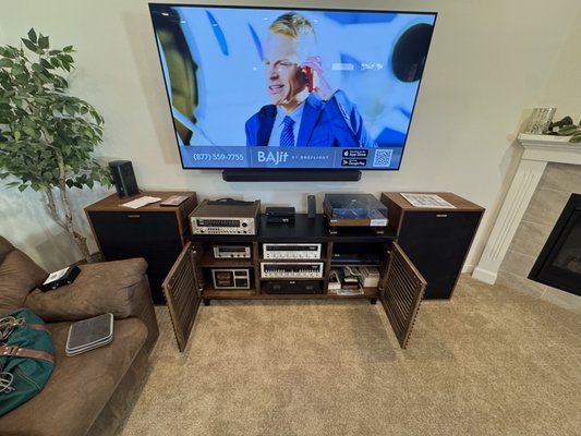 Old School meets New School! - We recently completed an exciting project where we integrated vintage AV equipment with cutting-edge technology. Our team seamlessly set up a new flat-screen TV paired with a Sonos Arc soundbar, alongside 3 AV receivers, a phono player, cassette player, 8-track system, multi-disc CD player, DVD player, and VHS player. The result? A perfectly blended setup that combines nostalgia with modern functionality. Most importantly, we ensured everything was user-friendly, allowing our client to enjoy their upgraded entertainment system with ease. Old School meets New School! - We recently completed an exciting project where we integrated vintage AV equipment with cutting-edge technology. Our team seamlessly set up a new flat-screen TV paired with a Sonos Arc soundbar, alongside 3 AV receivers, a phono player, cassette player, 8-track system, multi-disc CD player, DVD player, and VHS player. The result? A perfectly blended setup that combines nostalgia with modern functionality. Most importantly, we ensured everything was user-friendly, allowing our client to enjoy their upgraded entertainment system with ease.