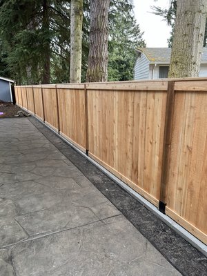 Fence - Installed a fence on a slope. On top of a retaining wall. Fence - Installed a fence on a slope. On top of a retaining wall.