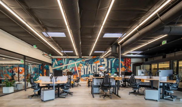 Office Interior Design & Remodel - Stage3 Agency Office in Pasadena - Converted from an abandon car repair shop, the Stage3 Office remodel was envisioned as a modern workspace that seamlessly blends functionality with sophistication. The design concept for Stage3 embodies a contemporary aesthetic with a focus on natural materials and clean lines. The wooden slats screen serves as the heart of the workspace, providing a central working area for meetings, brainstorming sessions, and informal discussions. Addition of skylights to the office maximize natural light and create a sense of openness and transparency. Together, these elements create a dynamic and inviting environment that fosters innovation and teamwork. Office Interior Design & Remodel - Stage3 Agency Office in Pasadena - Converted from an abandon car repair shop, the Stage3 Office remodel was envisioned as a modern workspace that seamlessly blends functionality with sophistication. The design concept for Stage3 embodies a contemporary aesthetic with a focus on natural materials and clean lines. The wooden slats screen serves as the heart of the workspace, providing a central working area for meetings, brainstorming sessions, and informal discussions. Addition of skylights to the office maximize natural light and create a sense of openness and transparency. Together, these elements create a dynamic and inviting environment that fosters innovation and teamwork.