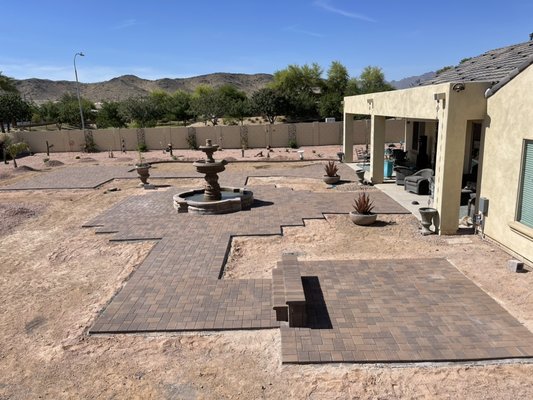 Paver Project Laveen AZ. - “Paver Project Laveen AZ.
New home needed some livable outdoor space. Paver areas and walkways with fountain accent in the middle.
Also a Jacuzzi Paver Pad on North side with Paver matching steps. Artificial turf area on South side.
Customer was very pleased with end result.” Paver Project Laveen AZ. - “Paver Project Laveen AZ.
New home needed some livable outdoor space. Paver areas and walkways with fountain accent in the middle.
Also a Jacuzzi Paver Pad on North side with Paver matching steps. Artificial turf area on South side.
Customer was very pleased with end result.”