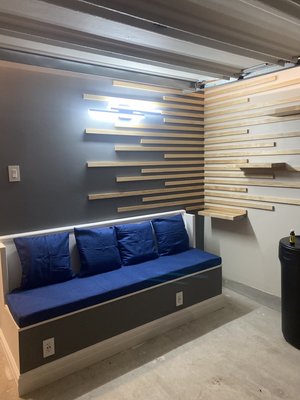Garage Remodeling Project - Manor, TX - In this garage remodeling, we do the framing, drywall, tape and float, flooring for the new office was made, in the same way a bank was built outside, a television was installed with wood detail and epoxy was applied to the floor.