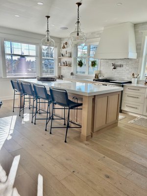 Kitchen Remodel - Our kitchen remodel transformed an outdated space with a poor layout into a modern, functional hub. The new design features a more efficient layout that enhances workflow, with beautiful Rift oak and painted MDF cabinetry providing a sleek, contemporary look. A convenient pot filler was installed above the range, and new flooring and lighting brighten the entire space. The addition of stylish new backsplash tile completes the transformation, bringing a fresh and inviting atmosphere to the heart of the home. Kitchen Remodel - Our kitchen remodel transformed an outdated space with a poor layout into a modern, functional hub. The new design features a more efficient layout that enhances workflow, with beautiful Rift oak and painted MDF cabinetry providing a sleek, contemporary look. A convenient pot filler was installed above the range, and new flooring and lighting brighten the entire space. The addition of stylish new backsplash tile completes the transformation, bringing a fresh and inviting atmosphere to the heart of the home.