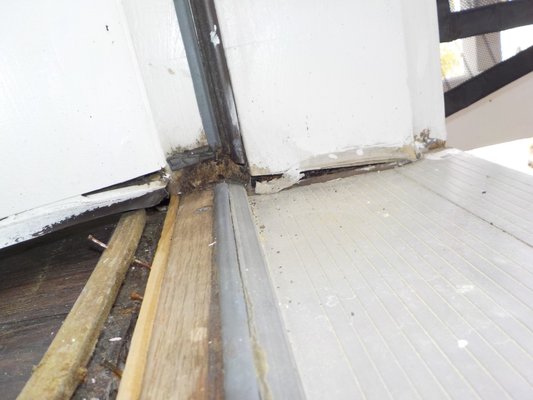 Water intrusion - An exterior door sill in a 2008 condo that has not been maintained ( caulked ) perhaps since new. Even though exterior condo maintenance is NOT the owners responsibility it can easily become the buyers problem. The metal sill should slope away from the home, this one slopes toward the home. The rain is now directed toward the home, under the gaps at the edges and into the floor and inside the wall below. The interior floor flexes, the metal sill flexes and I can see through a small opening some of the damage in the floor. The buyers agent was able to negotiate repairs that could extend to the condo below. I would guess repairs are 10 times my fee. As usual, small evidence, big cost Water intrusion - An exterior door sill in a 2008 condo that has not been maintained ( caulked ) perhaps since new. Even though exterior condo maintenance is NOT the owners responsibility it can easily become the buyers problem. The metal sill should slope away from the home, this one slopes toward the home. The rain is now directed toward the home, under the gaps at the edges and into the floor and inside the wall below. The interior floor flexes, the metal sill flexes and I can see through a small opening some of the damage in the floor. The buyers agent was able to negotiate repairs that could extend to the condo below. I would guess repairs are 10 times my fee. As usual, small evidence, big cost