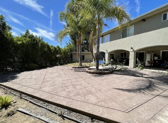 Los Angeles Project - Freshly poured and finished! We just completed this beautiful stamped and colored concrete patio project. The design features a stunning stamped pattern that adds texture and character, while the custom color blend complements the home's exterior perfectly. This durable and low-maintenance patio is ready to be a great space for relaxing and entertaining. Los Angeles Project - Freshly poured and finished! We just completed this beautiful stamped and colored concrete patio project. The design features a stunning stamped pattern that adds texture and character, while the custom color blend complements the home's exterior perfectly. This durable and low-maintenance patio is ready to be a great space for relaxing and entertaining.