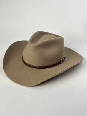Cowboy Hats - Our felt hats are crafted from the finest materials, including 100% premium wool felt and luxurious beaver fur felt, known for their exceptional durability, weather resistance, and ability to hold their shape over time.[2] These hats are perfect for cooler climates or for those seeking a more formal Western look. For warmer weather or a more casual style, our straw hats are an ideal choice. Each hat is a testament to the enduring legacy of Western fashion, designed to be a cherished part of your wardrobe for years to come. Explore our portfolio to discover the perfect cowboy hat that reflects your individual style and embodies the rugged elegance of the West.