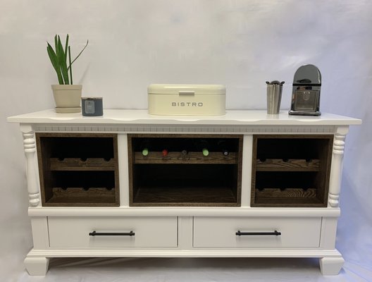 White credenza - wine bottle slots - Dimensions: L 66” - W 19” - H 33”
- Colour: Brandy Cream
- Stain: Dark walnut
- Solid wood credenza with 17 bottle spaces
- Middle section for wine glasses
- Bottom soft close drawers for extra storage White credenza - wine bottle slots - Dimensions: L 66” - W 19” - H 33”
- Colour: Brandy Cream
- Stain: Dark walnut
- Solid wood credenza with 17 bottle spaces
- Middle section for wine glasses
- Bottom soft close drawers for extra storage