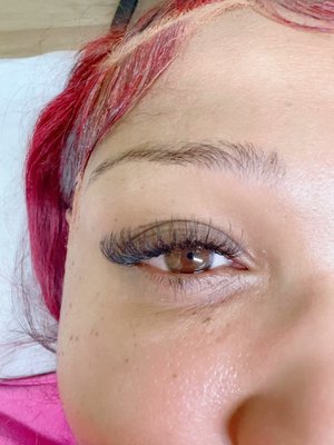 Hybrid Lashes - Discover the perfect blend of Classic and Volume with our Hybrid Lash extensions. Achieve a balanced look that combines the natural appeal of Classic lashes with the added fullness and dimension of Volume lashes. Ideal for those desiring a versatile style that enhances without overpowering. Experience the best of both worlds with our Hybrid Lashes.