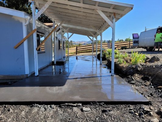Awning and concrete pad - Shade awning addition to back of house with concrete pad and concrete walkway to front of house