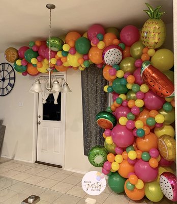 TWO-ty Fruity Birthday Balloon Garland - Customer reached out to me a week before the event , luckily I was available to make her vision come to life a night before her event! She had an inspiration picture of a garland she wanted it to look alike to, and I was so glad to have been able to bring it to life for her . She wanted something big for her daughter, who LOVES balloons . This is our Double Thick Garland , made with bigger balloons instead of the regular sized balloons .