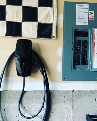 Tesla Wall Connector. Universal J1772 - This is a new Tesla Universal Wall Connector EV Charger. Built in capability to power share your Tesla with a different brand of EV.