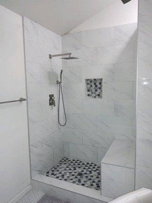 Master Bathroom - Our Client called us and asked to remodel the shower in their Master Bathroom. So we added a bench and enlarged the shower, new tile and fixtures.