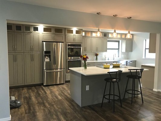Full Kitchen Remodel - This remodel included replacing the cabinets with new ones from JNK cabinetry, installing Quartz countertop, Removing load-bearing wall, installing Vinyl floors, finishing the Backsplash, and Paint.