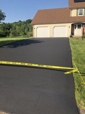 Freshly Seal Coated Driveway - A few cracks repaired and a fresh seal coat layer make this driveway looks like it had just been laid down! Freshly Seal Coated Driveway - A few cracks repaired and a fresh seal coat layer make this driveway looks like it had just been laid down!