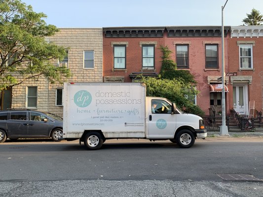 Specialty Delivery In Brooklyn, NYC - Nicholas and the team were tasked with delivering a sectional to a customer's home in Brooklyn, NY. The historic charm of the Brooklyn neighborhood brought its own set of challenges, as the houses were tightly packed together, and the narrow doorways of the older homes made maneuvering furniture a tricky task. As expected, the sectional couldn't fit through the front door of the customer's home.

However, in a stroke of ingenuity, Nicholas noticed that the customer’s backyard backed up to her sister’s home on the next street. Thinking outside the box, he devised a plan: they would bring the sectional through the sister's home, cross the backyard, and enter through the back door of the customer's house. The team executed the plan perfectly, navigating the sectional through the sister’s house and successfully completing the delivery through the backyard.

Thanks to Nicholas' quick thinking and problem-solving, the delivery was made without a hitch, and the customer was thrilled with the service!