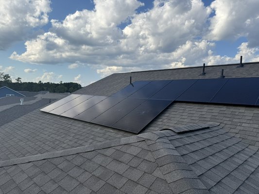 Retrofit Solar System Add-On - We expanded this homeowner’s solar system by adding 12 new panels to the lower left and right of the existing array, giving them a noticeable boost in energy production.

When adding on to an existing system, the goal isn’t just function — it’s design. We carefully blended the new panels with the old so the array looks seamless, as if it was always built this way. A clean look matters just as much as clean performance.

This was a fun project for the crew to tackle. The attic work in particular had us weaving around rafters like it was an action movie set — the kind of install that keeps things exciting while still delivering top-quality results.

In the end, the system not only produces more power but looks as if it rolled off the roof as one complete design. Another install we’re proud to stand behind.